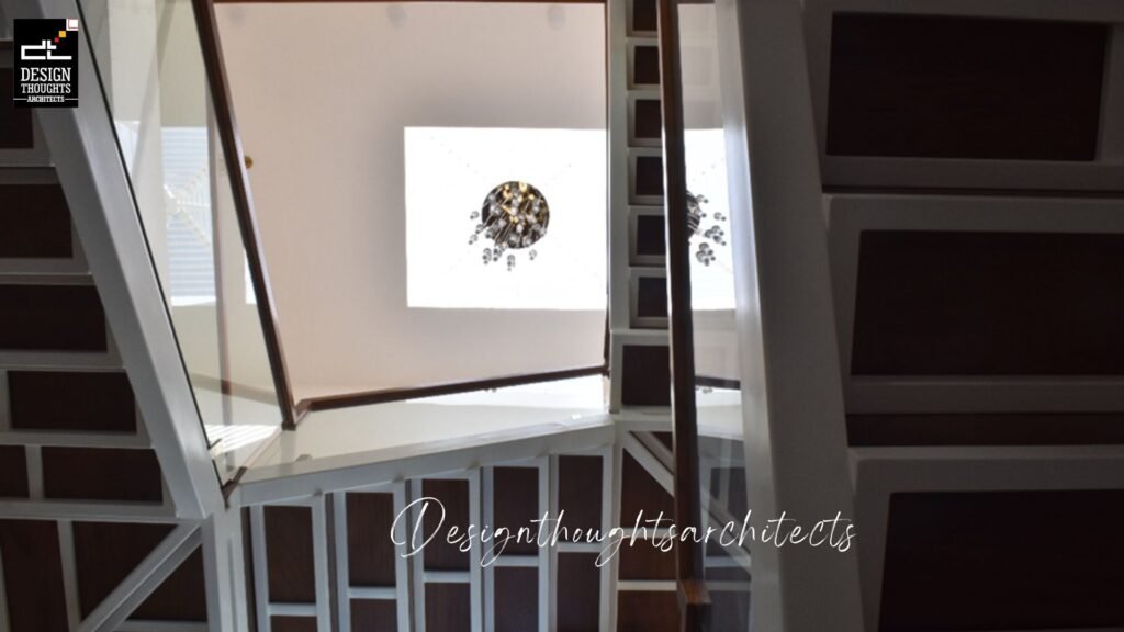 Staircase With Skylight and Chandelier