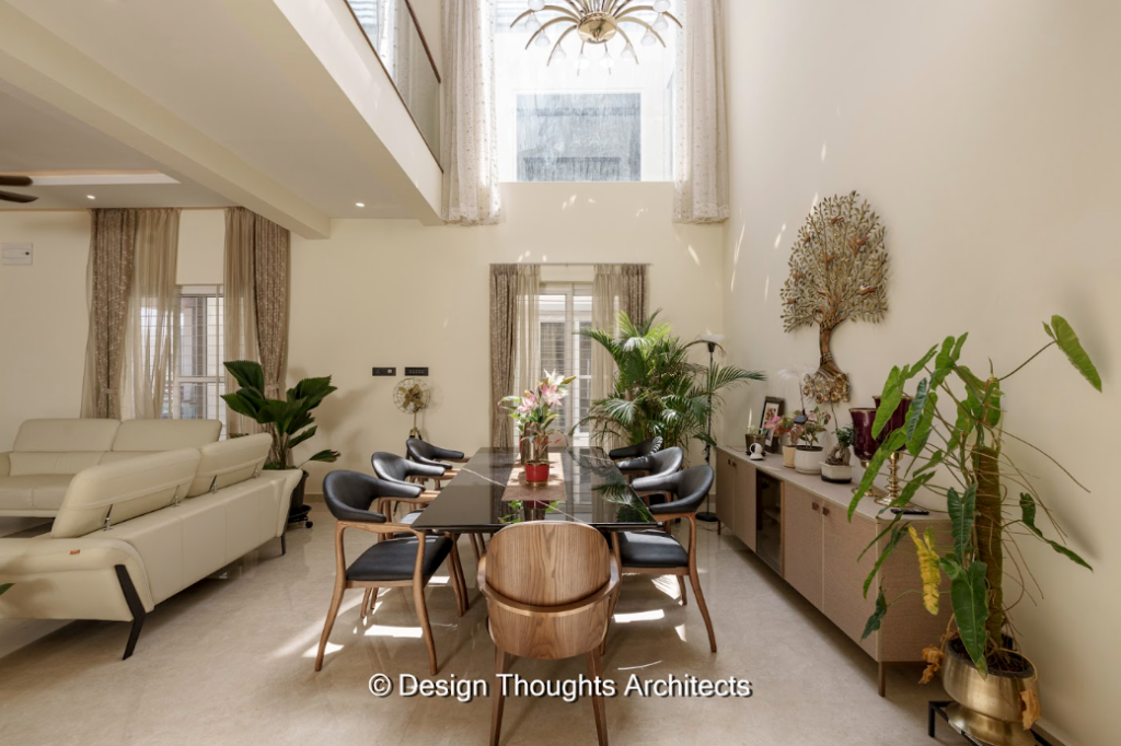 3D visualisation in architecture showing a double-height living and dining space with natural light