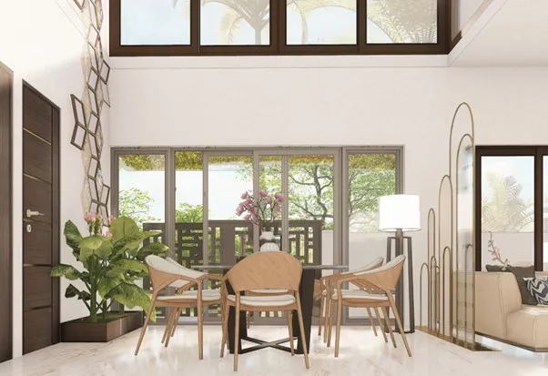 Spanish House Design showing a double-height dining area with large windows, natural light, and elegant seating
